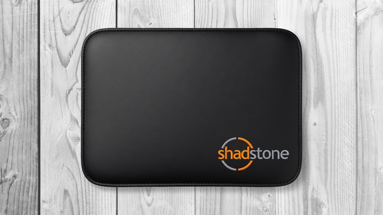 Black Shadstone laptop sleeve on a wood background